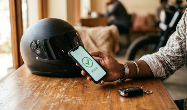 Driver making an online traffic challan payment on a smartphone