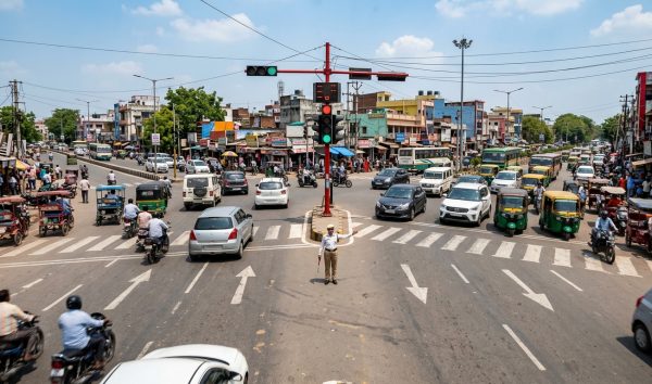 Indian traffic junction with automated signals and police enforcing the traffic fine list