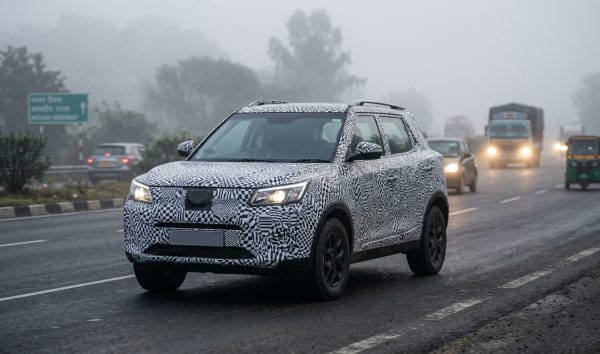 Camouflaged upcoming electric cars in India undergoing road testing on a highway